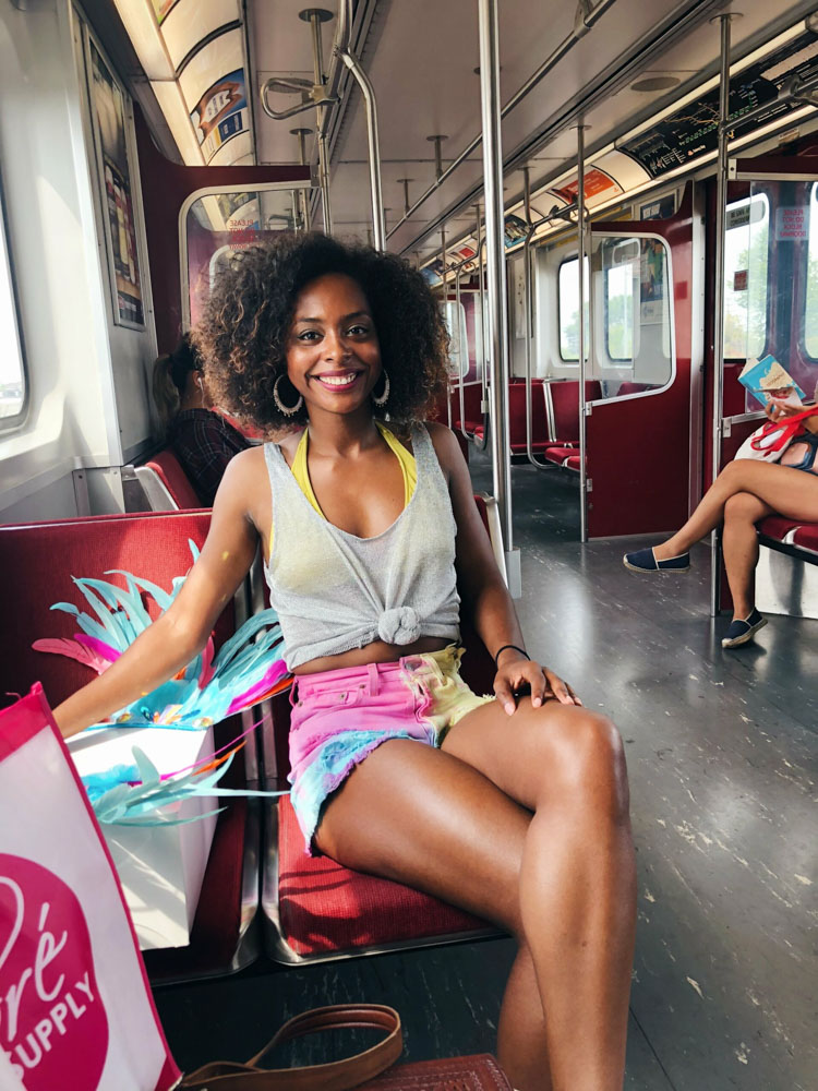 Sitting on Toronto metro with Caribana costume