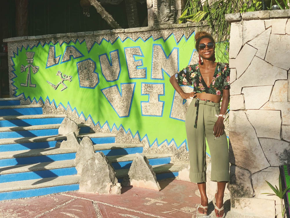 Standing in front of restaurant in Tulum