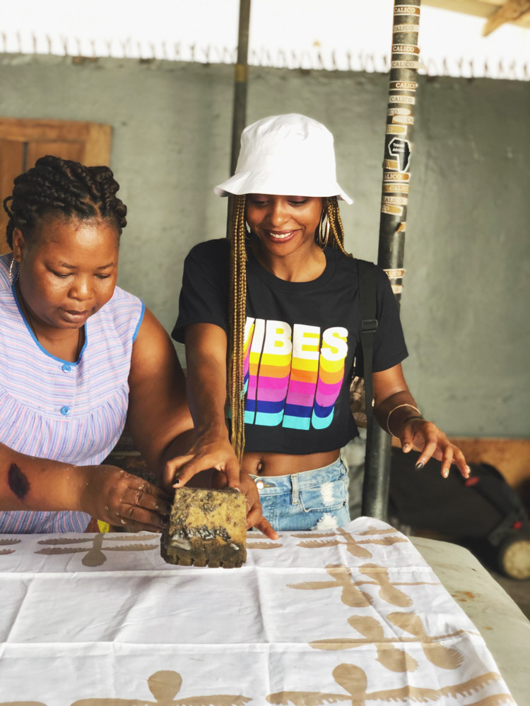 Jewels creating batik fabric in Accra