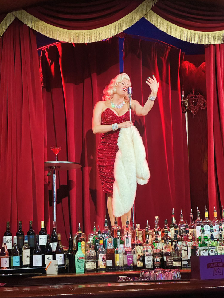 Performer singing at Dueling Piano Show at Beach Club Boulevard