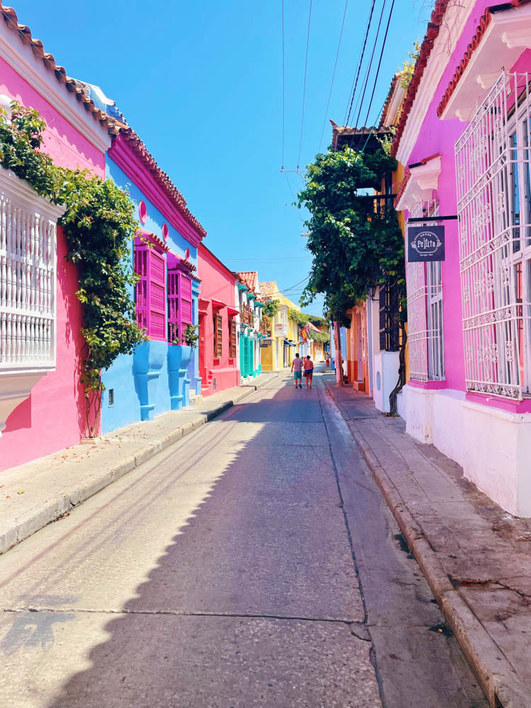 Colorful street in Cartagena filled with bright buildings